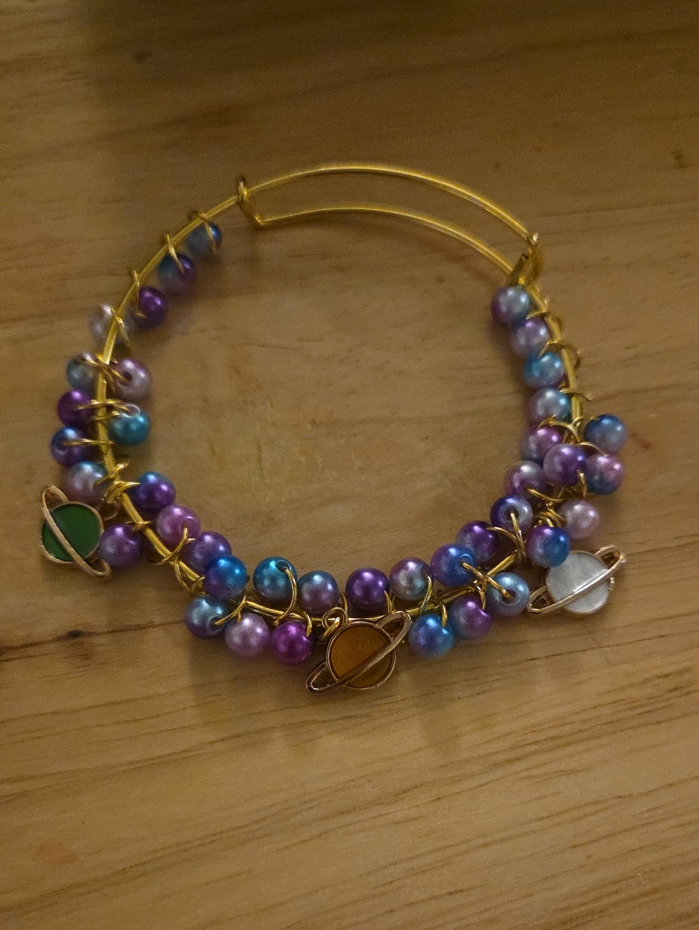 Gold Tone Multi-Color Pearl Saturn Charm Bangle Bracelet